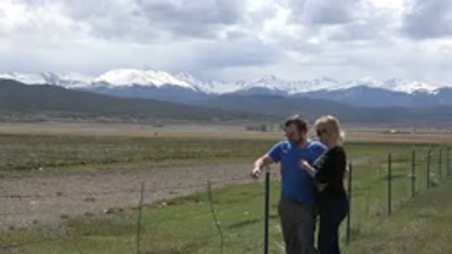 TAOS NEW MEXICO-2015: Loving Husband And Wife Smile Brightly In Front Of A