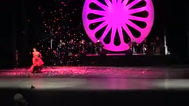 CABO SAN LUCAS MEXICO-2019: Asian Group Dance With Several Men And One Woman On Colorful Stage