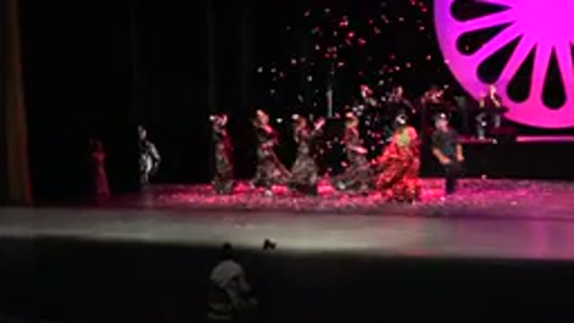 CABO SAN LUCAS MEXICO-2019: A Stage Performance Showing The Main Subject In A Red Dress
