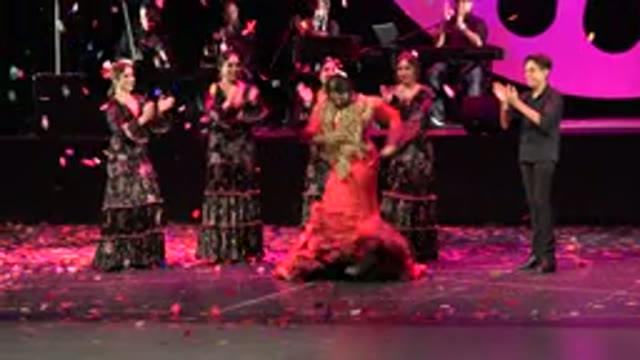 CABO SAN LUCAS MEXICO-2019: Dancer In A Purple Dress Performing On Stage For