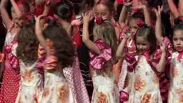 CABO SAN LUCAS MEXICO-2019: Girls Wearing Pink And White Dresses Raise Arms On Stage