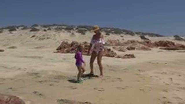 CABO SAN LUCAS MEXICO-2019: Mother And Daughter Playing On The Beach