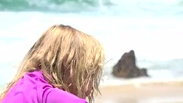 CABO SAN LUCAS MEXICO-2019: Little Kid On Beach Seemingly Playing Around In The Sand