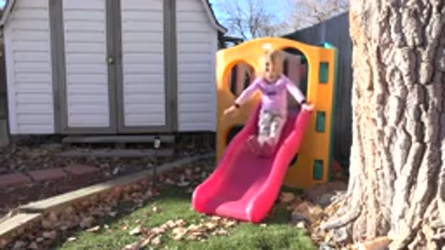 WESTMINSTER COLORADO-2019: Little Girl Playing On A Slide