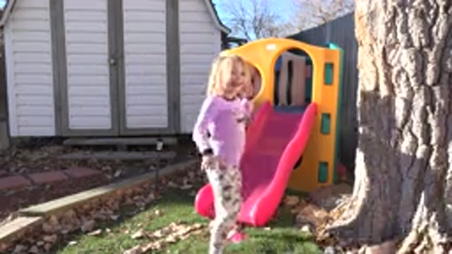 WESTMINSTER COLORADO-2019: Little Girl Runs to Play Slide, Turns and Jumps