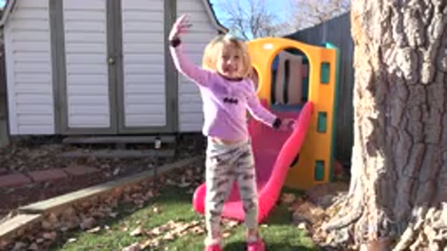 WESTMINSTER COLORADO-2019: Child Girl Garden Dancing Playing Backyard Slide Toy