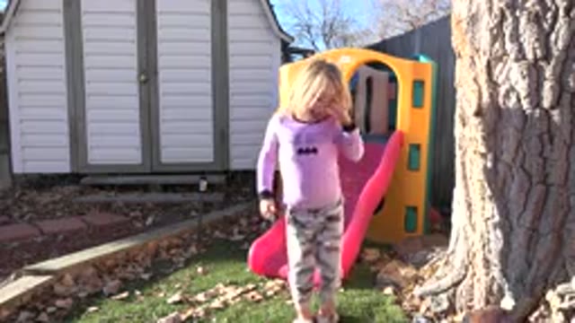WESTMINSTER COLORADO-2019: Little Girl in Pink Jumping in Backyard