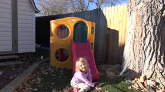 WESTMINSTER COLORADO-2019: Young Girl Talking Laughing Climbing And Jumping On
