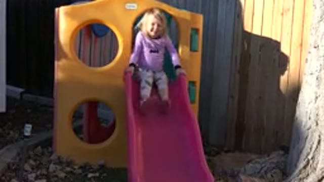 WESTMINSTER COLORADO-2019: Little Girl Prepares To Take A Slide