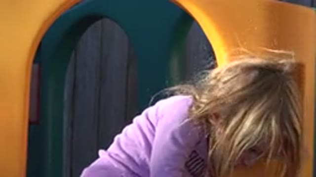 WESTMINSTER COLORADO-2019: Little Girl Plays on Slide in Backyard