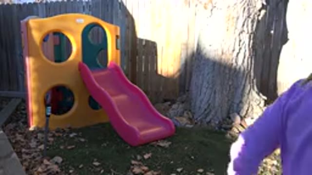 WESTMINSTER COLORADO-2019: Child Walking Near The Slide In The Backyard Of His