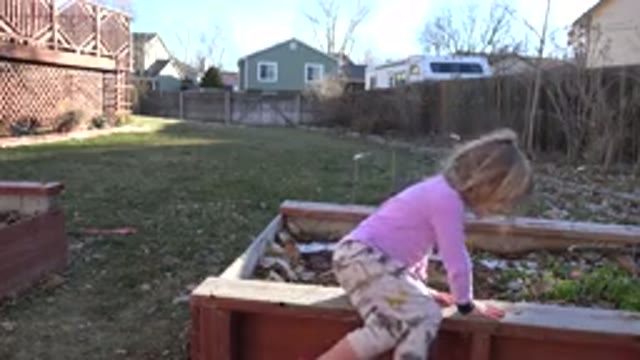 WESTMINSTER COLORADO-2019: A Little Girl in Pink Dress Sitting on Garden Furniture