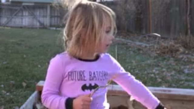 WESTMINSTER COLORADO-2019: Young Girl In A Backyard Playing With A Stick And Dancing