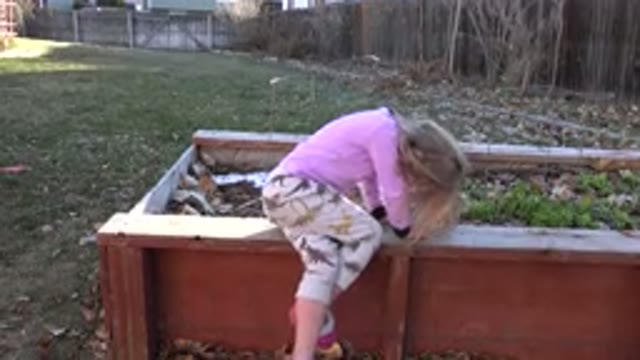 WESTMINSTER COLORADO-2019: Girl Sitting In Wooden Tank On Grass Location With