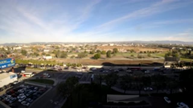 LOS ANGELES CALIFORNIA-2019: Cars Driving On A City Street With Trees And Sky