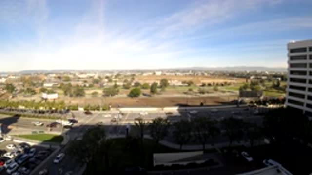 LOS ANGELES CALIFORNIA-2019: Traffic White Building And Blue Sky On A Sunny Day