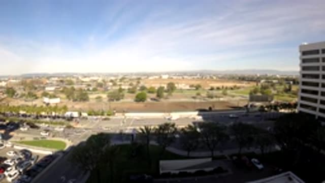 LOS ANGELES CALIFORNIA-2019: Time Lapse Of A Busy Intersection Adjacent To Some