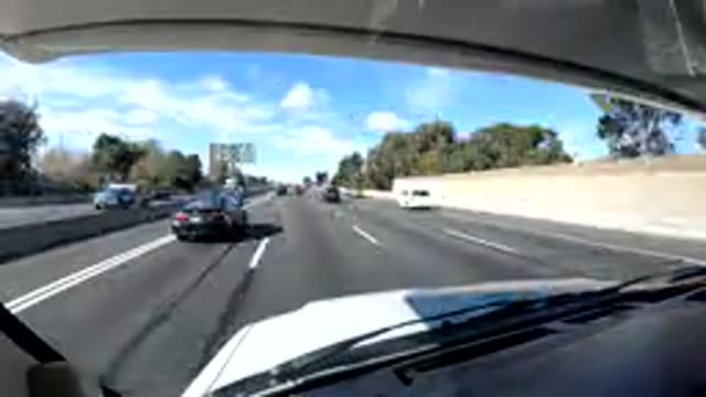 CENTRAL COAST CALIFORNIA-2019: Rapid Approaching Traffic and Blue Sky Along Highway