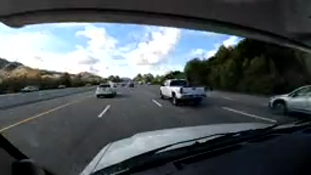 CENTRAL COAST CALIFORNIA-2019: A Car Traveling On Highway With Other Vehicles