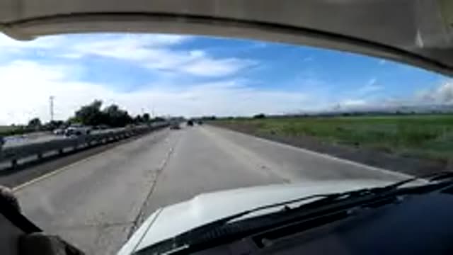 CENTRAL COAST CALIFORNIA-2019: Driving Fast Through Cars On The Green And Wooded