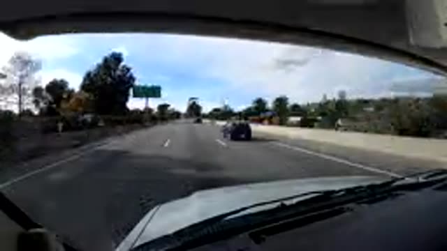 CENTRAL COAST CALIFORNIA-2019: Rapid Approaching Green Trees and Highway Sign
