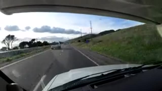 CENTRAL COAST CALIFORNIA-2019: Rapid Approaching Traffic and Green Trees Along Highway