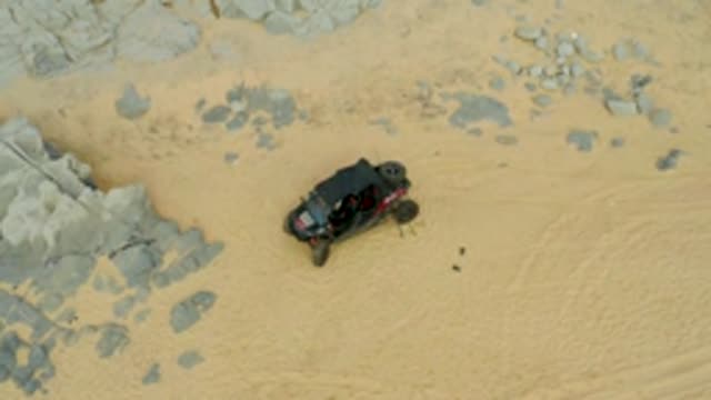 LAGUNA BEACH LOS CABOS BCS MEXICO-2021: Off-road Vehicle Navigating Sandy and Rocky Terrain