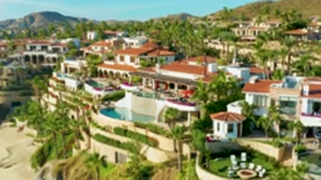 PLAYA ACAPULQUITO LOS CABOS BCS MEXICO-2021: Beachside Resort with Person Leaving Sand