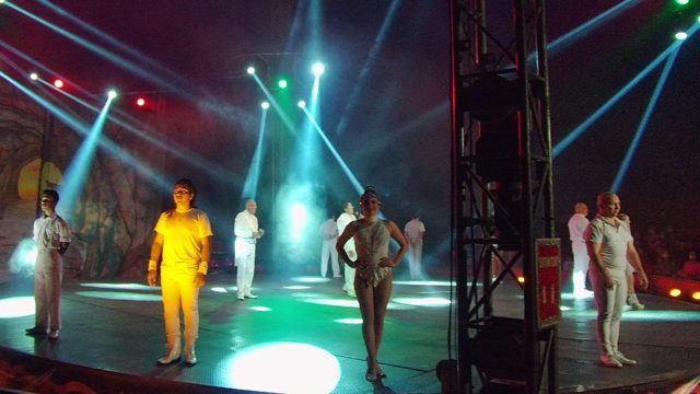 SAN JOSE DEL CABO BCS MEXICO-2022: Stage Performers in White Outfits Under Colored Lights