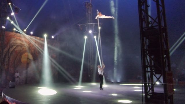 SAN JOSE DEL CABO BCS MEXICO-2022: Aerial Performer on Vertical Pole with Stage Lights