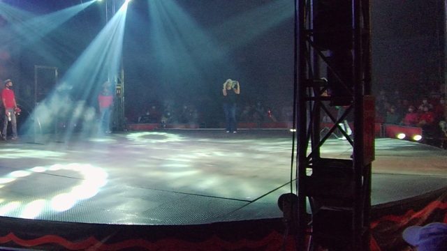 SAN JOSE DEL CABO BCS MEXICO-2022: Stage Performer Adjusting Microphone with Smoke and Lights