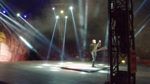 SAN JOSE DEL CABO BCS MEXICO-2022: Stage Performer Swinging Large Axe Under Spotlights