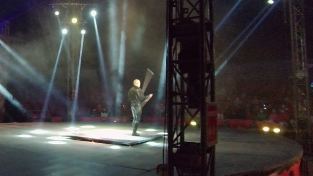 SAN JOSE DEL CABO BCS MEXICO-2022: Stage Performer Wielding Large Prop Under Spotlights