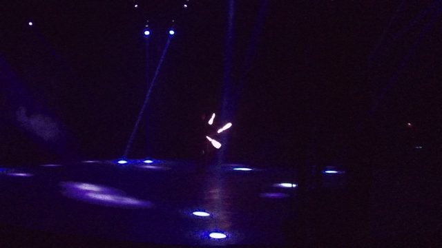 SAN JOSE DEL CABO BCS MEXICO-2022: Glowing Stick Dancer on Dark Stage
