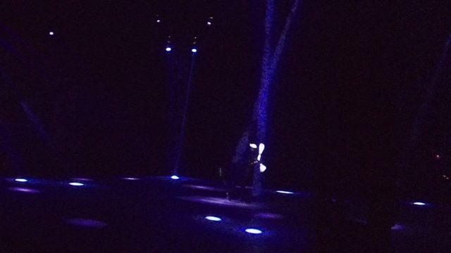 SAN JOSE DEL CABO BCS MEXICO-2022: Stage Performer Juggling Light Sticks in Dark Environment