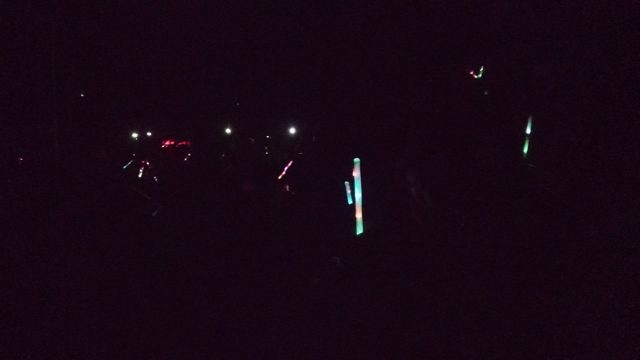 SAN JOSE DEL CABO BCS MEXICO-2022: People Waving Glowing Sticks at Nighttime Event