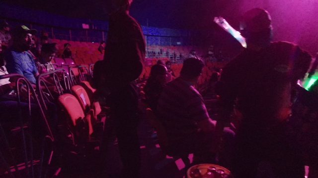SAN JOSE DEL CABO BCS MEXICO-2022: Person Moving Fluffy Object in Dimly Lit Club