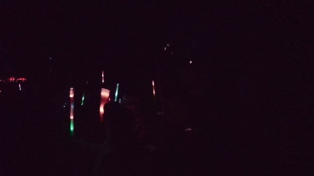 SAN JOSE DEL CABO BCS MEXICO-2022: Crowd Waving Glowing Sticks at Night Event