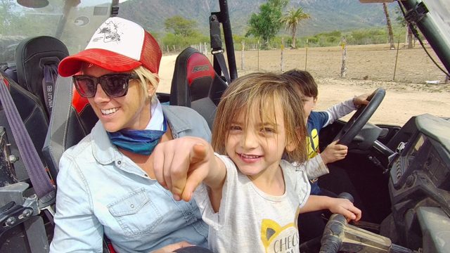 LOS CABOS BCS MEXICO-2022: Woman and Child in Dune Buggy Interacting with Camera
