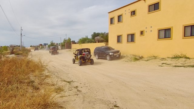 LOS CABOS BCS MEXICO-2022: Off-Road Vehicle Driving on Dusty Dirt Road