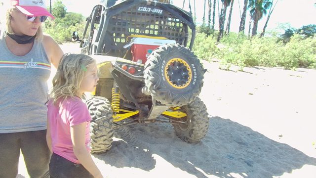 LOS CABOS BCS MEXICO-2022: Woman and Children Near Off-Road Vehicle on Sand
