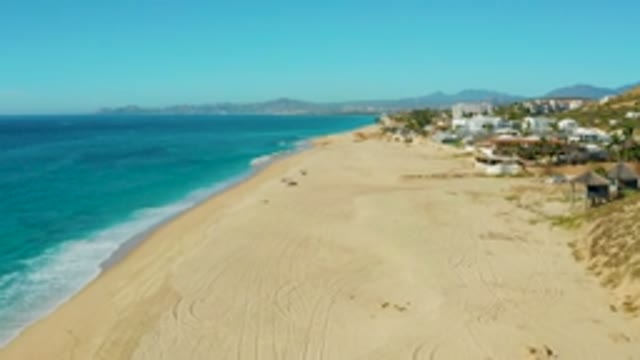 BUZZARDS EAST CAPE LOS CABOS BCS MEXICO-2022: Sandy Beach with Turquoise Ocean Waves