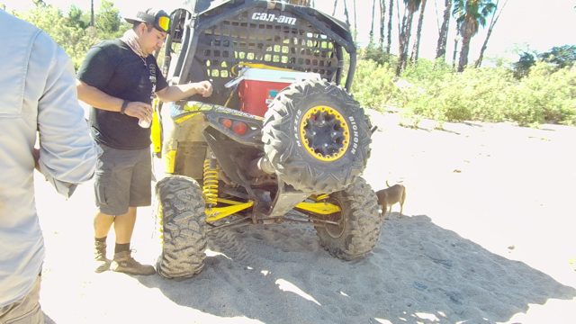 LOS CABOS BCS MEXICO-2022: Man Adjusting All-terrain Vehicle on Sandy Beach