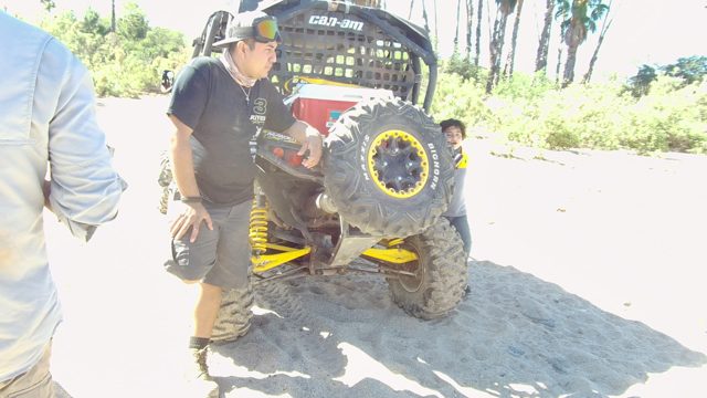 LOS CABOS BCS MEXICO-2022: Man and Child near Small Off-road Vehicle on Sand