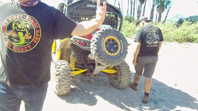 LOS CABOS BCS MEXICO-2022: Men Interacting Near Off-Road Vehicle on Sand