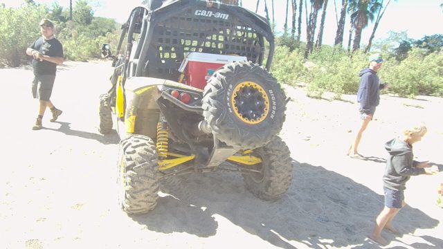 LOS CABOS BCS MEXICO-2022: People Moving Around Yellow Off-road Vehicle on Sand