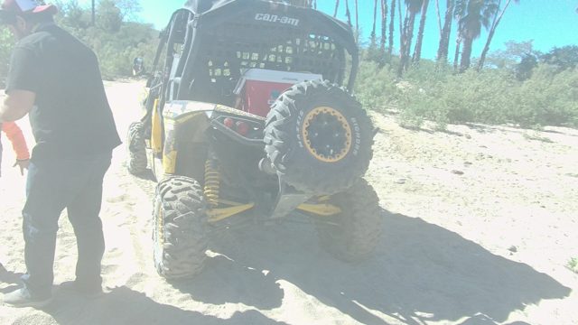 LOS CABOS BCS MEXICO-2022: Man Interacting with Dune Buggy on Sandy Shore