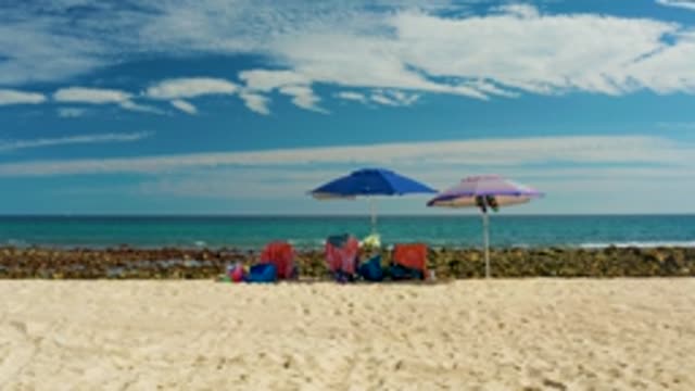 EL TULE LOS CABOS BCS MEXICO-2022: Beach with Umbrellas and Gentle Ocean Waves