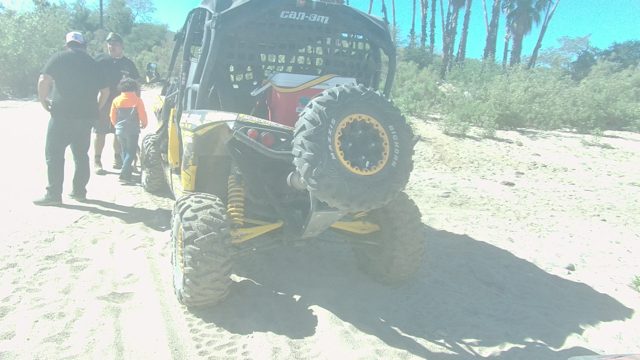 LOS CABOS BCS MEXICO-2022: Group of People Moving Around Off-Road Vehicle on Sand