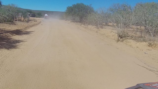 LOS CABOS BCS MEXICO-2022: Vehicle Driving on Sandy Desert Road